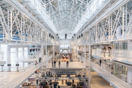 a group of people standing inside of a building